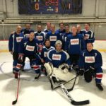 dr. gittleman with hockey team